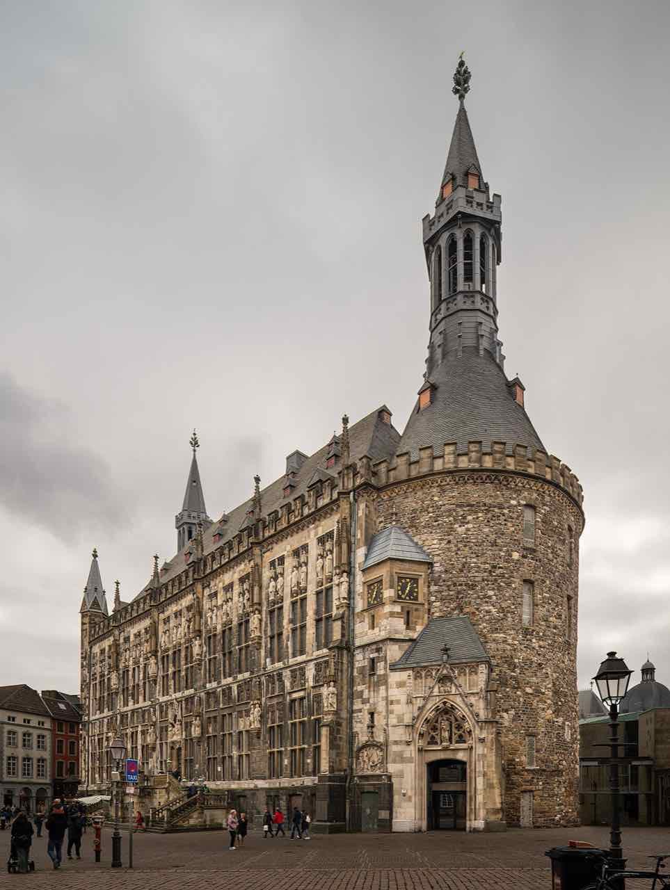 The north facade of Aachen town hall with its towers and statues, seen from the market square