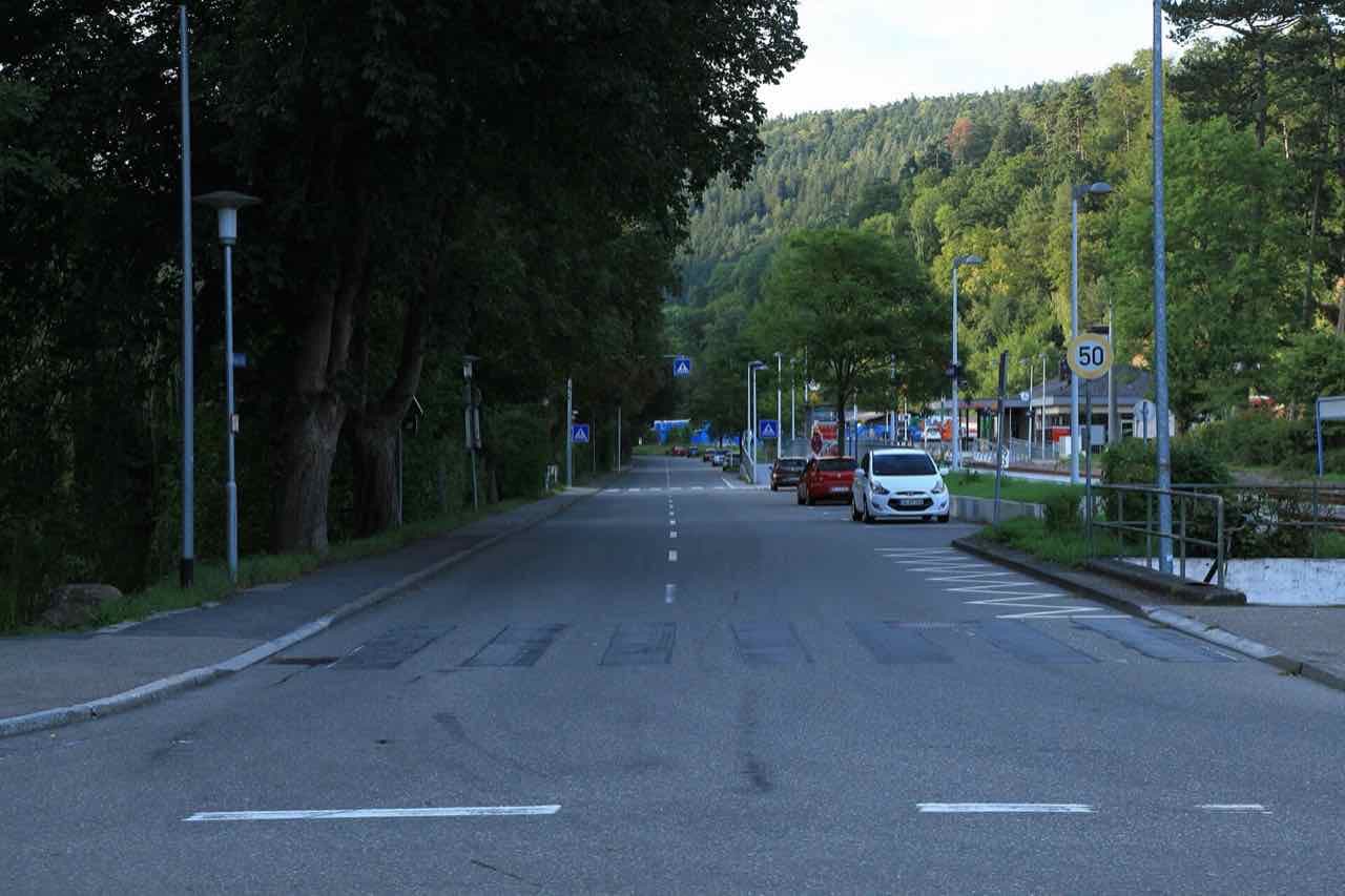 Regulastraße leading to Bad Liebenzell station with forested hill behind