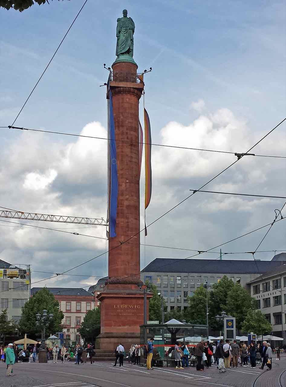 The Ludwigsmonument column on the Luisenplatz in Darmstadt, with trees and buildings around the square
