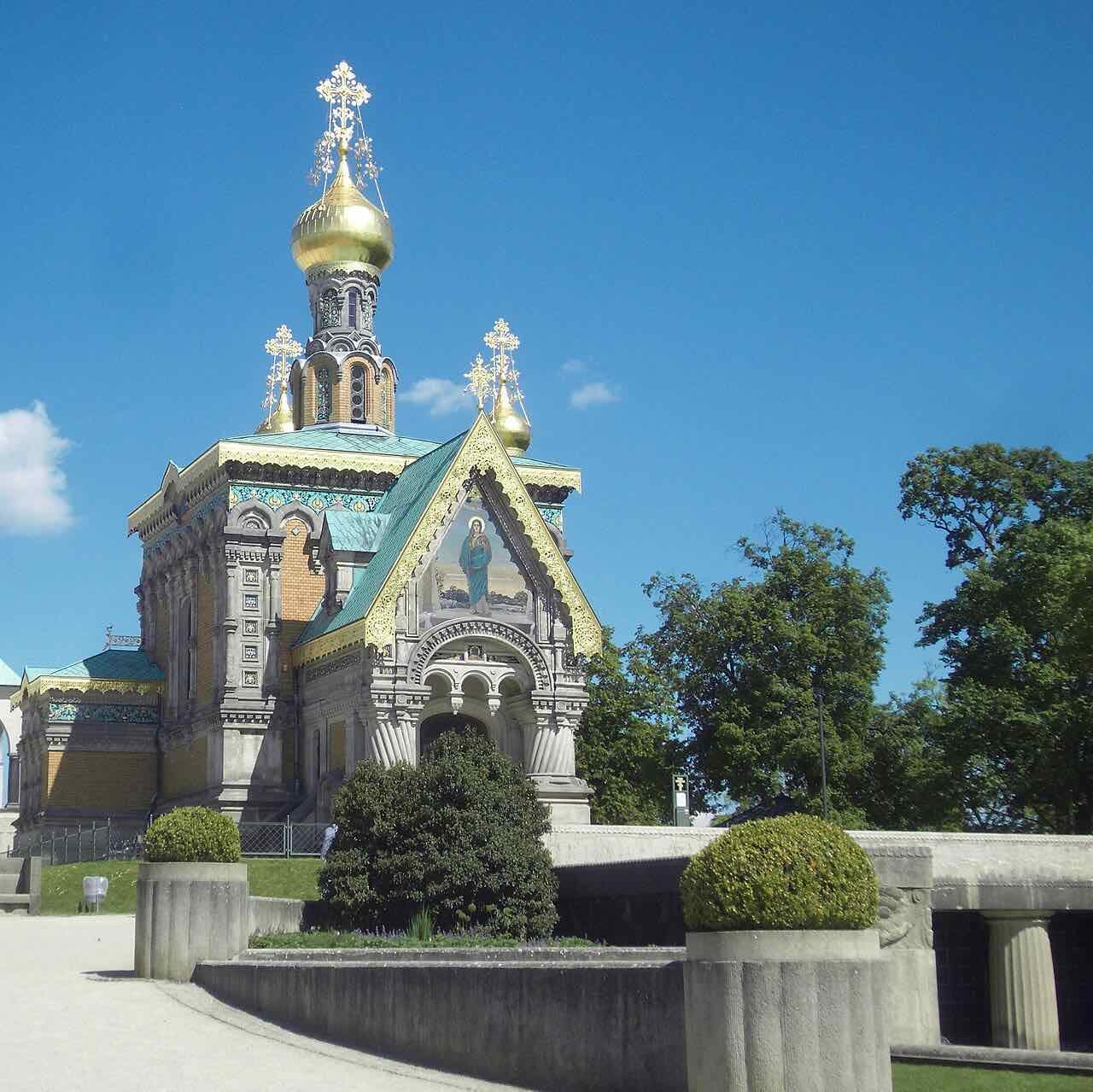 The Russian Chapel on the Mathildenhöhe with golden onion domes, green roofs and a mosaic above the entrance