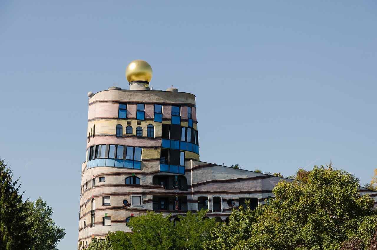 The Waldspirale in Darmstadt, a curved apartment building with a green roof and colourful facade by Hundertwasser