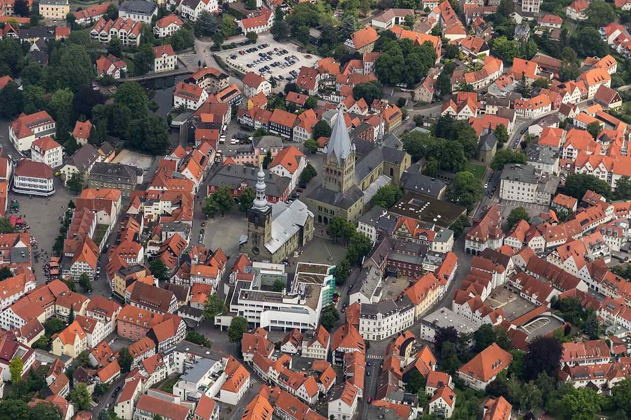 Aerial view of the old town of Soest with the Romanesque tower of the Patrokli cathedral, the Petri church and a dense mass of red tiled roofs