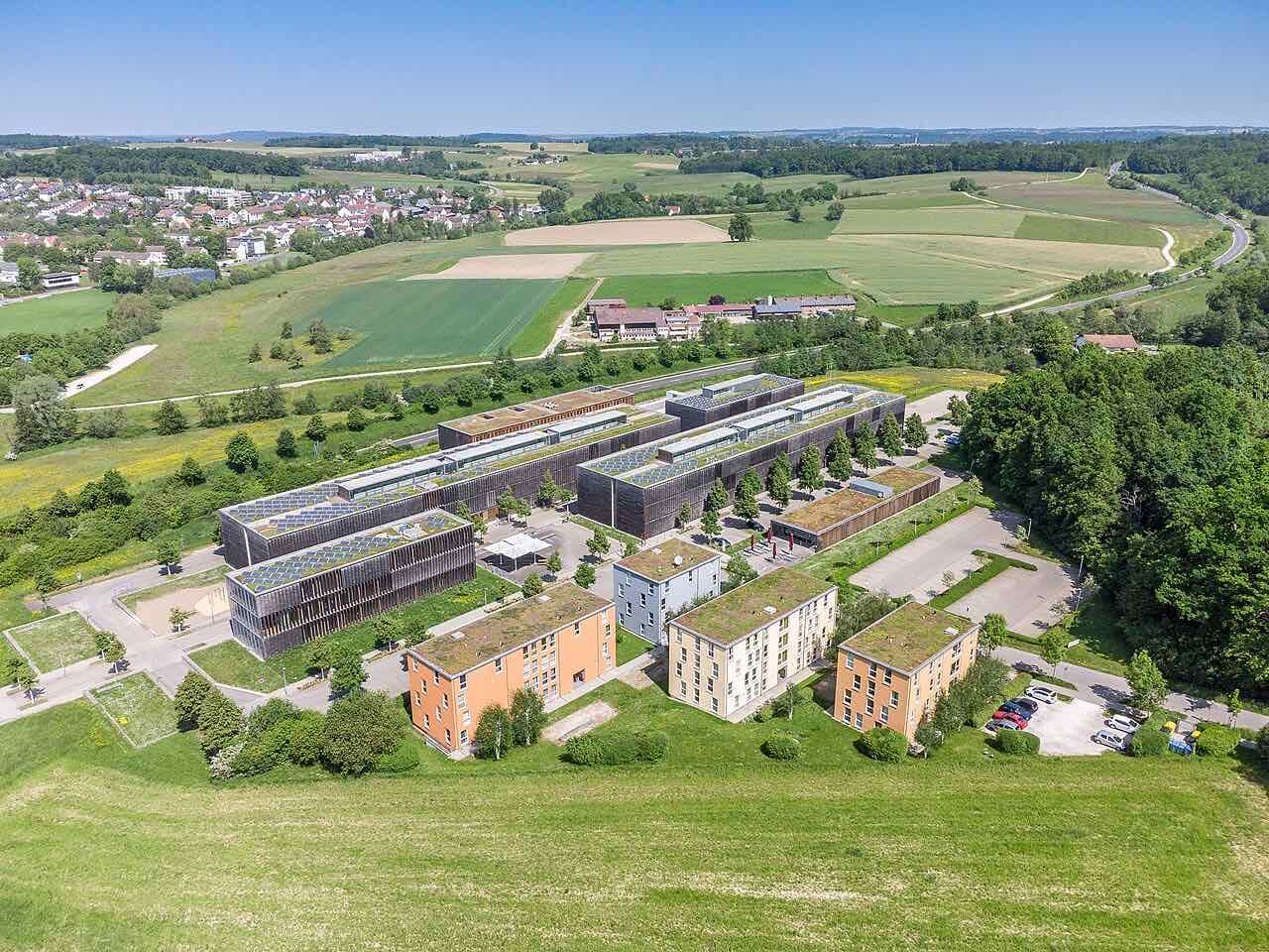 Buildings of the Burren campus of Aalen University seen from above, surrounded by trees