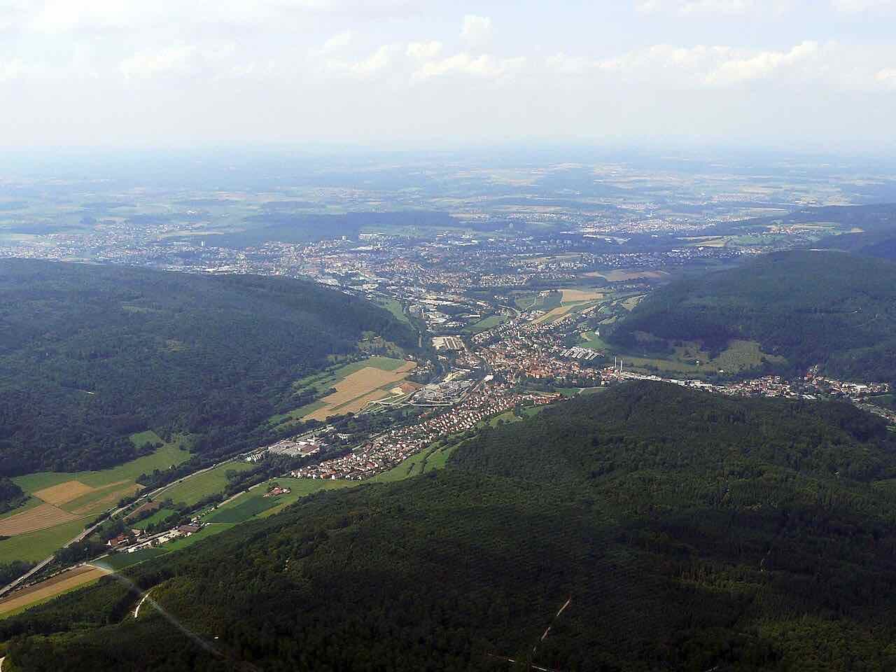 Aerial view of Aalen from the south, with the district of Unterkochen in front and the town centre behind it in the Kocher valley