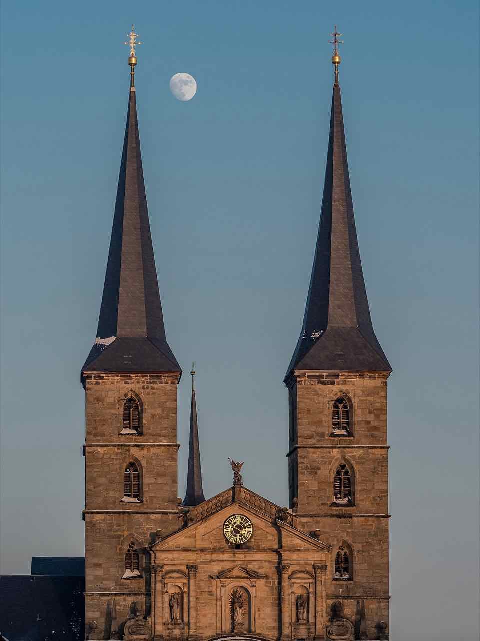 The two towers of the former Benedictine abbey church on the Michaelsberg rising above trees
