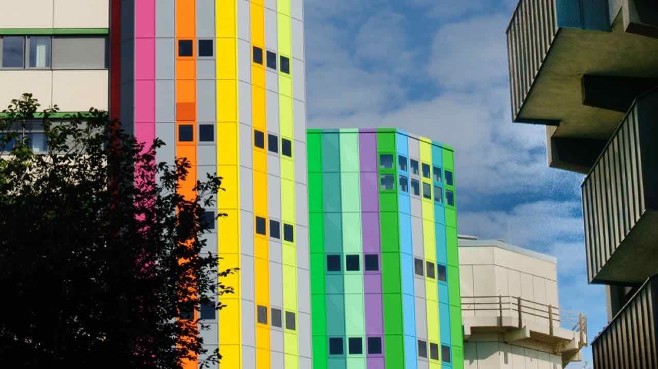 Brightly coloured stripes of green, blue, yellow and pink on tower facades at the University of Duisburg-Essen campus in Essen