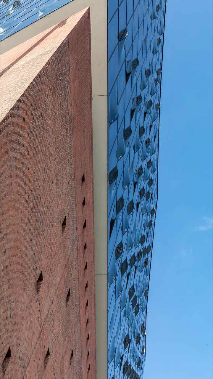 The east side of the Elbphilharmonie concert hall with its glass wave roof above the brick base