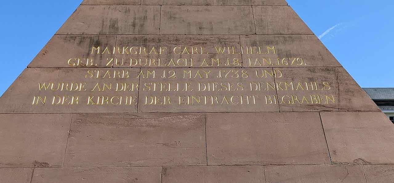The red sandstone Pyramide on the Karlsruhe Marktplatz with a gold inscription naming Margrave Karl Wilhelm