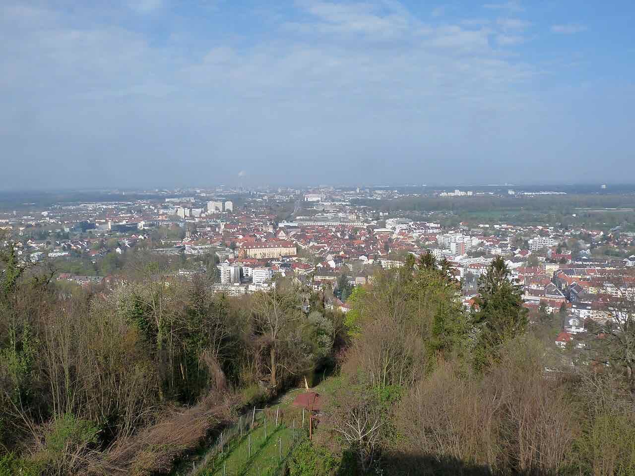 View from the Turmberg hill in Durlach over wooded slopes to the roofs of the city and the flat Rhine plain